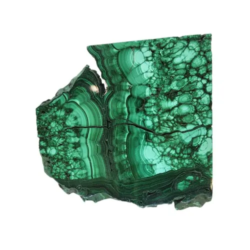 Close-up of malachite's concentric banding pattern showing light and dark green layers