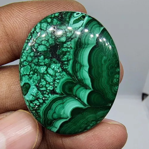Close-up showing malachite's crystalline structure and translucency at thin edges