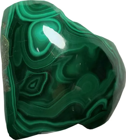 Comparison of polished and rough malachite showing banding variations